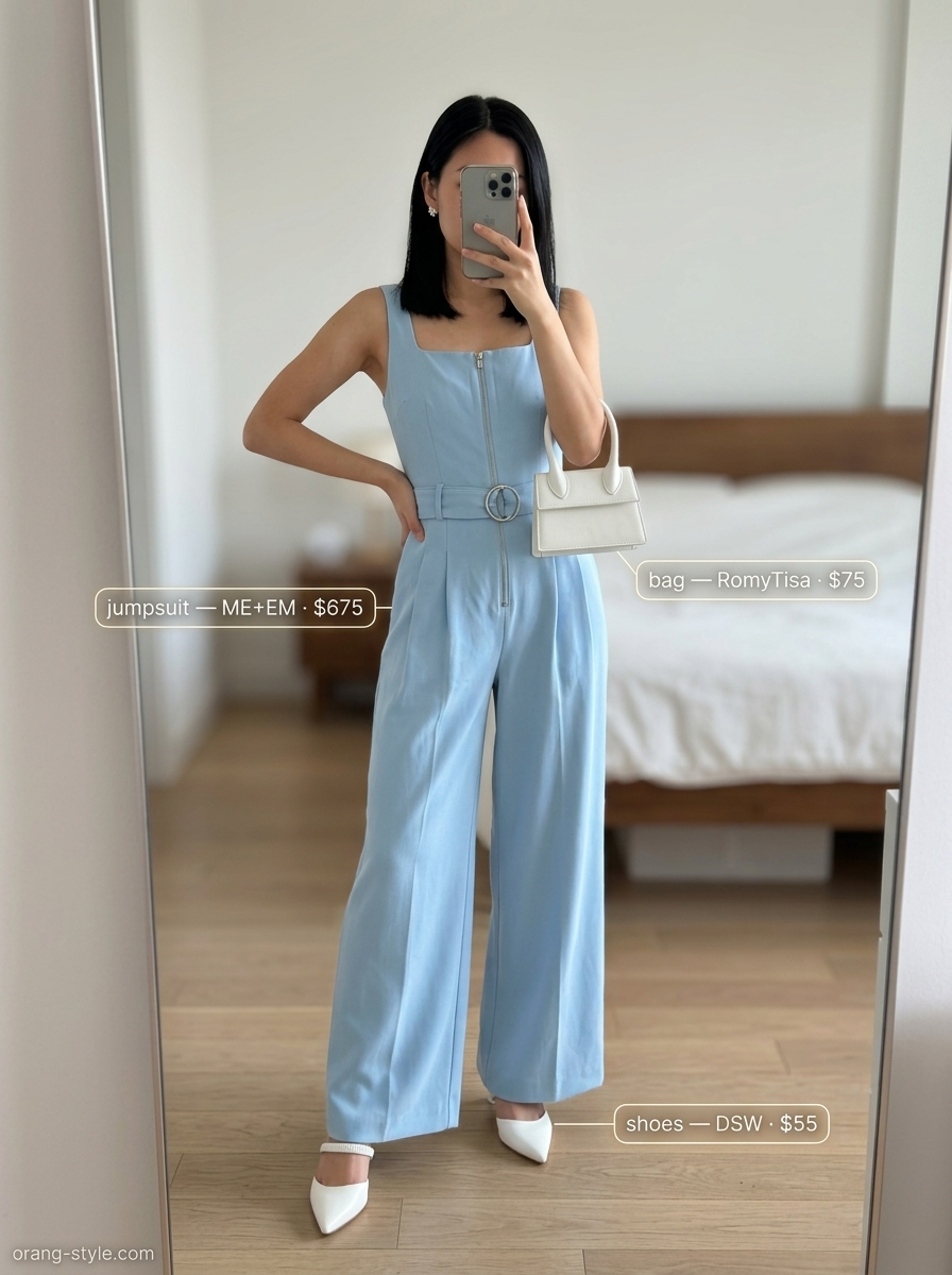 Sky blue jumpsuit outfit for women 2026: Wide-leg jumpsuit, white top-handle bag, mule heels, and silver earrings.