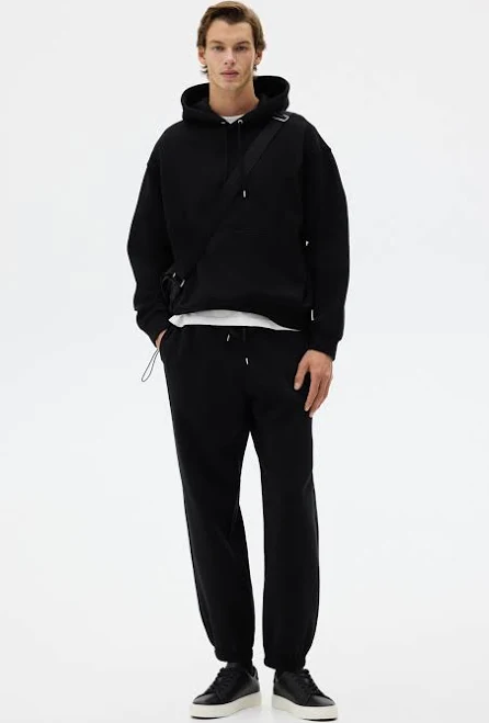 matching set H&M Men's Loose Fit Hoodie and Joggers Set H&M $49.99