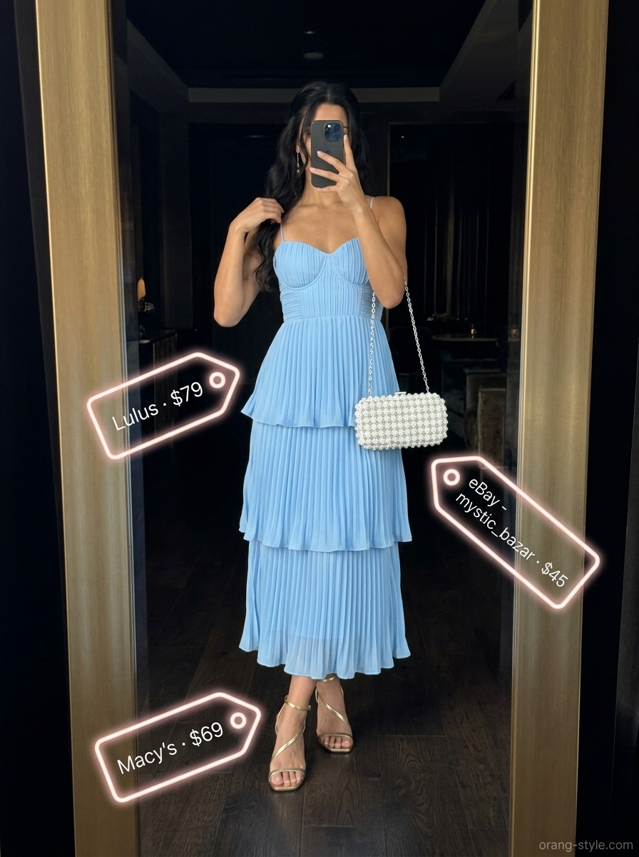 Ethereal sky blue chiffon dress, dreamy summer cocktail party outfit for women 2026. Midi length, tiered ruffles, pearl earrings.