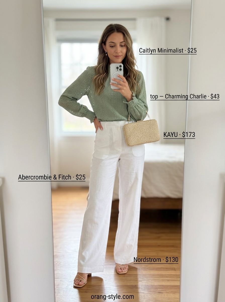 Sage green eyelet blouse with white linen trousers for a vineyard sunset dinner outfit 2026.
