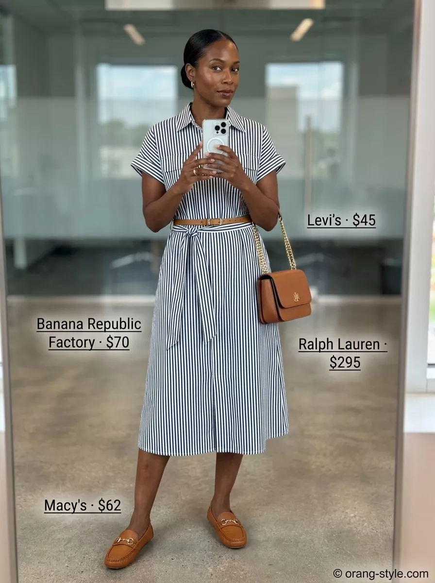 Breathable summer business casual outfit for women 2026: Navy and white striped shirt dress with tan loafers and bag.