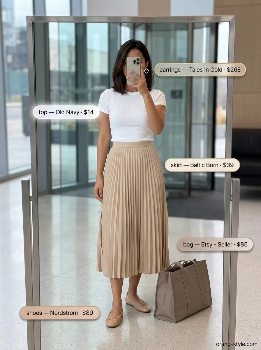 Breathable summer business casual outfit for women 2026: Beige pleated skirt, white knit top, tan tote.