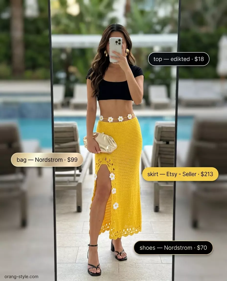 Crochet summer pool party outfits 2026: Mustard yellow crochet midi skirt with black crop top, gold earrings and clutch.