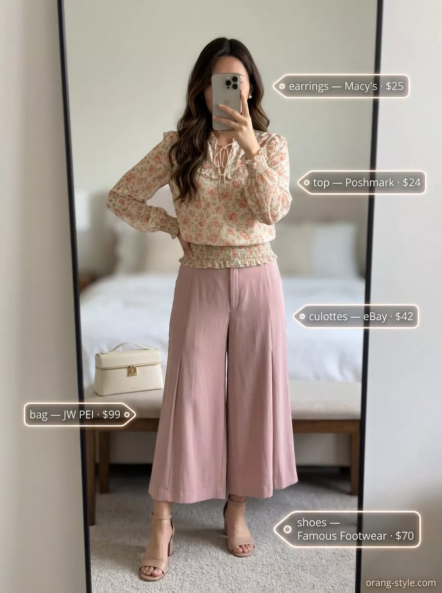 Feminine blush pink tailored culottes for women 2026 with a floral blouse and block heels for a garden party.