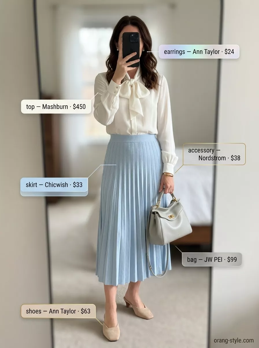 Refined soft blue midi skirt and ivory silk blouse with pearl studs for a summer old money outfit.