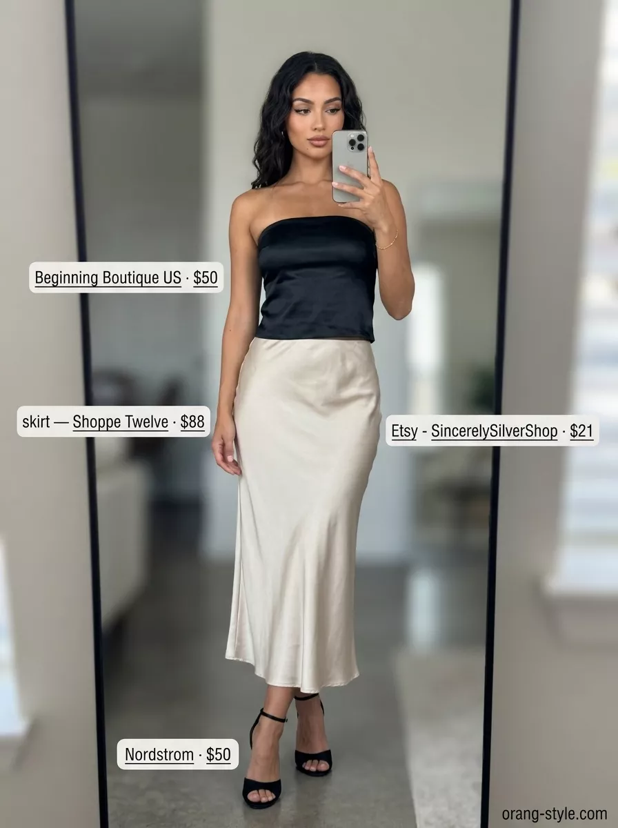Trendy summer tube top outfits for women 2026: Elegant black satin tube top with a champagne midi skirt, heels, and clutch for a cocktail party.