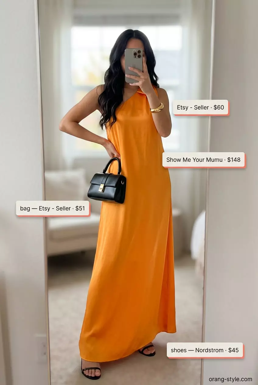 Mango orange maxi dress outfit: vibrant satin dress, black strappy heels, black clutch, gold cuff. Best Summer Outfits 2026.