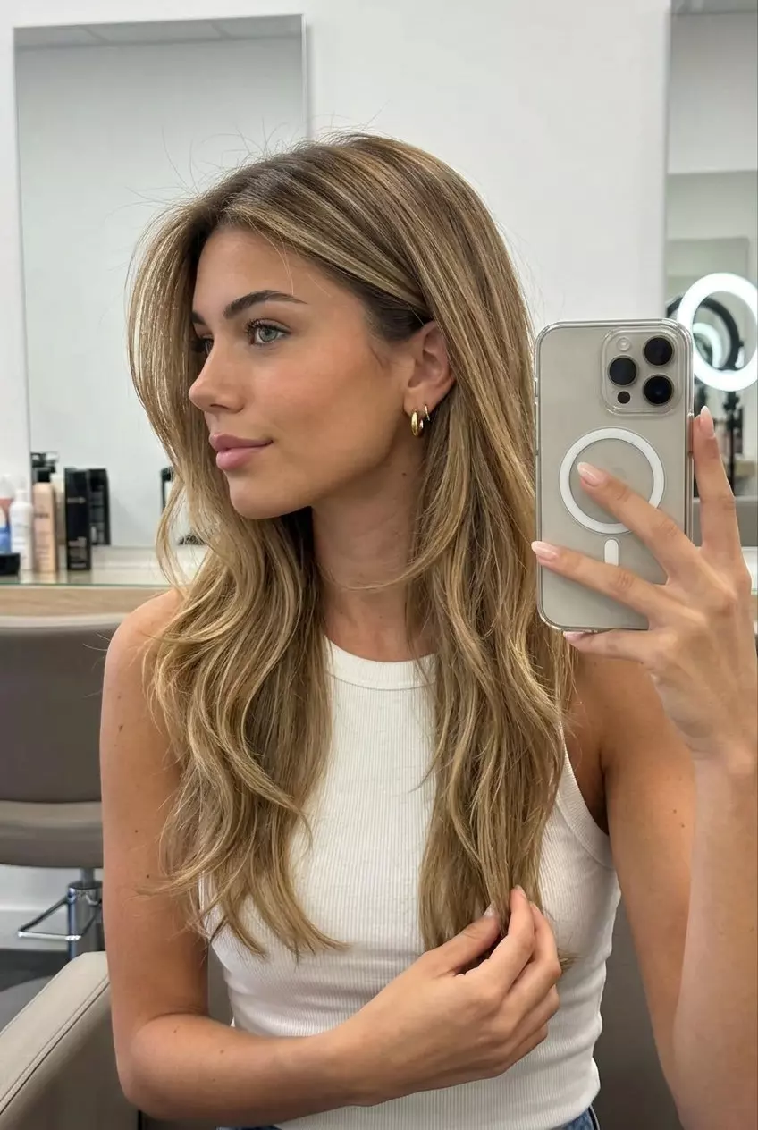 long butter bronde cascade with golden balayage highlights and face-framing layers for summer
