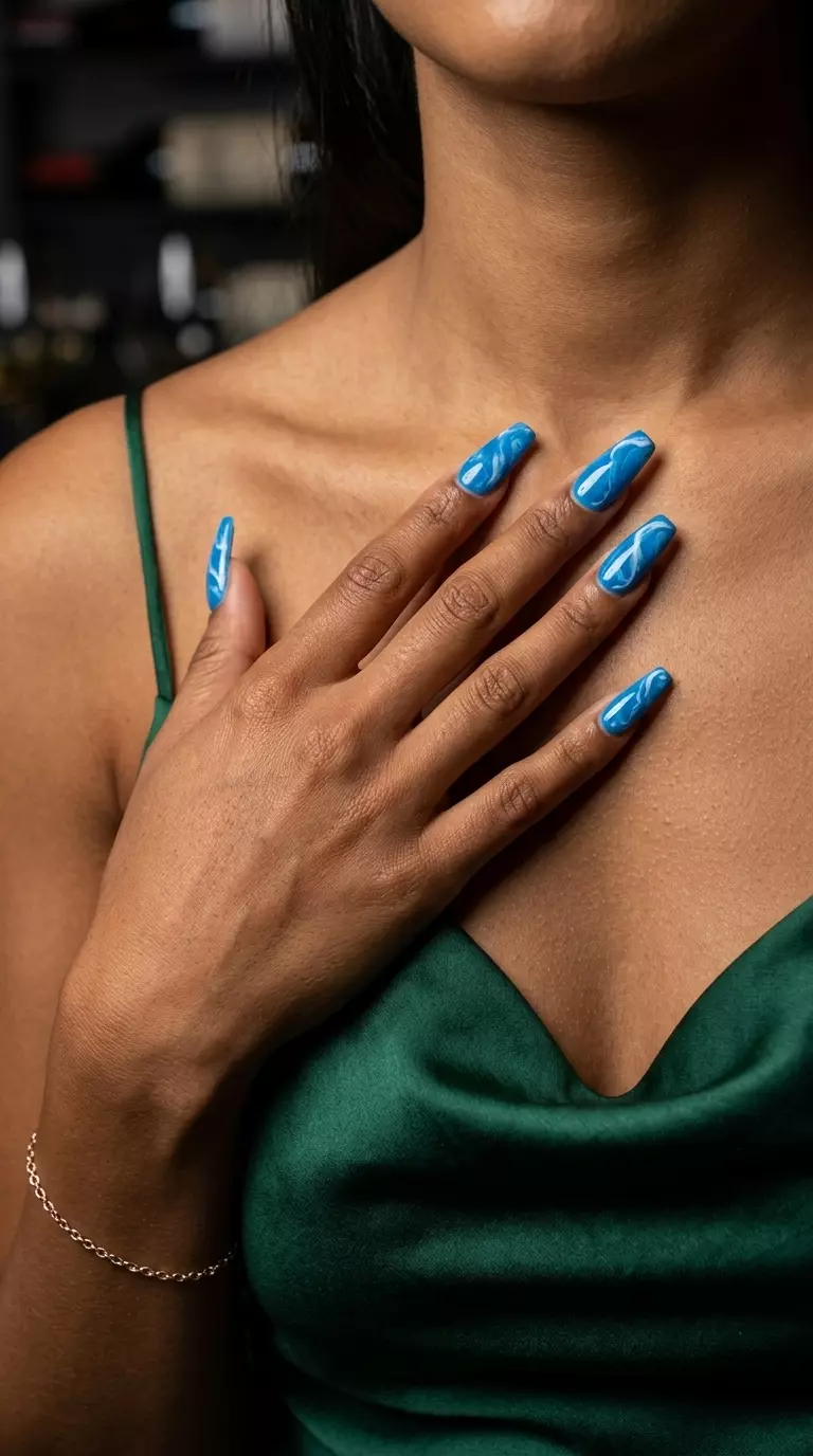 Colourful Summer Nails 2026: Cerulean Blue Marble Cerulean Blue Marble Coffin: Colourful summer nails 2026 for formal events with artistic blue swirls.