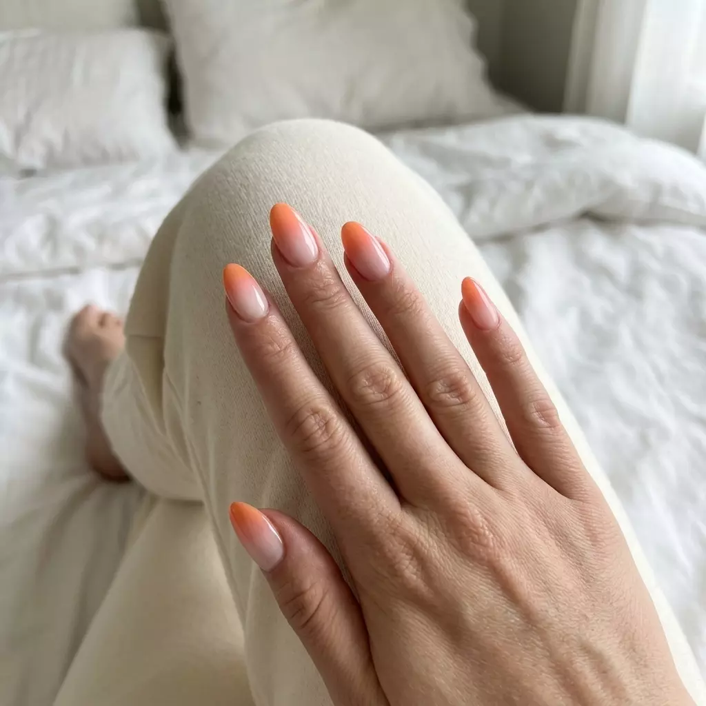 Colourful Summer Nails 2026: Fizzy Orange Sunset Fizzy Orange Sunset Airbrush Gradient: Colourful summer nails 2026 for vacation with ethereal orange hues.