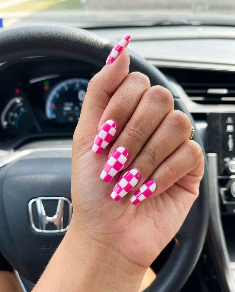 Hot Pink Checkerboard Coffin Nails 2026 Hot Pink Checkerboard Coffin nails with a bold pattern for glamorous colourful summer nails 2026.