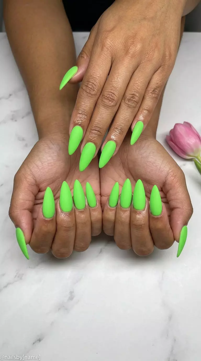 Cute summer nails 2026: Bold Matte Lime Stiletto nails for festivals and edgy events. Vibrant electric green.
