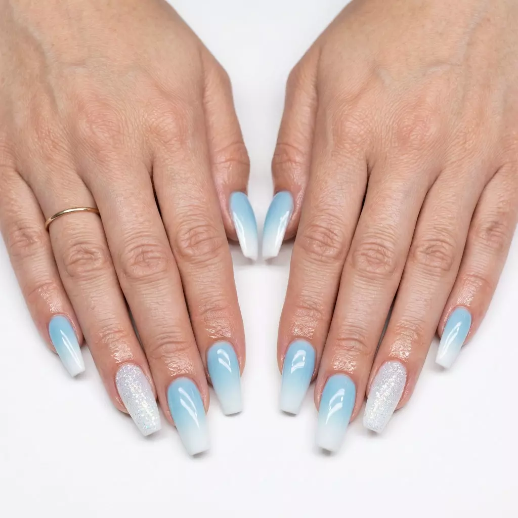 Cute summer nails 2026: Oceanic Ombre Sparkle oval nails for vacations and date nights. Blue to white gradient with glitter.