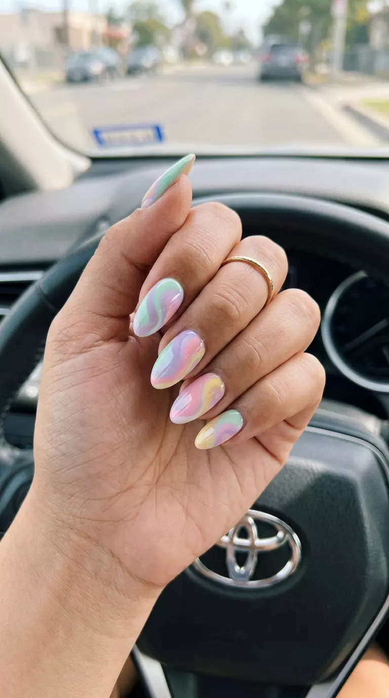 Cute summer nails 2026: Whimsical abstract pastel swirls on almond shape for casual days.
