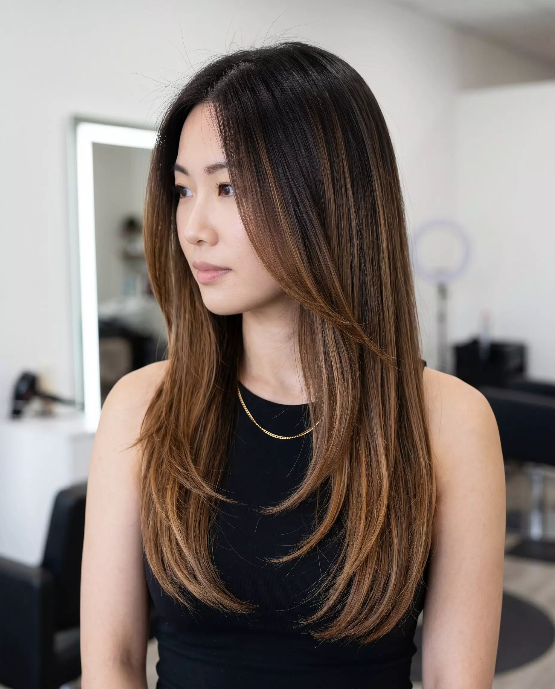 long espresso brown to caramel ombre with face-framing layers and subtle internal ribbons