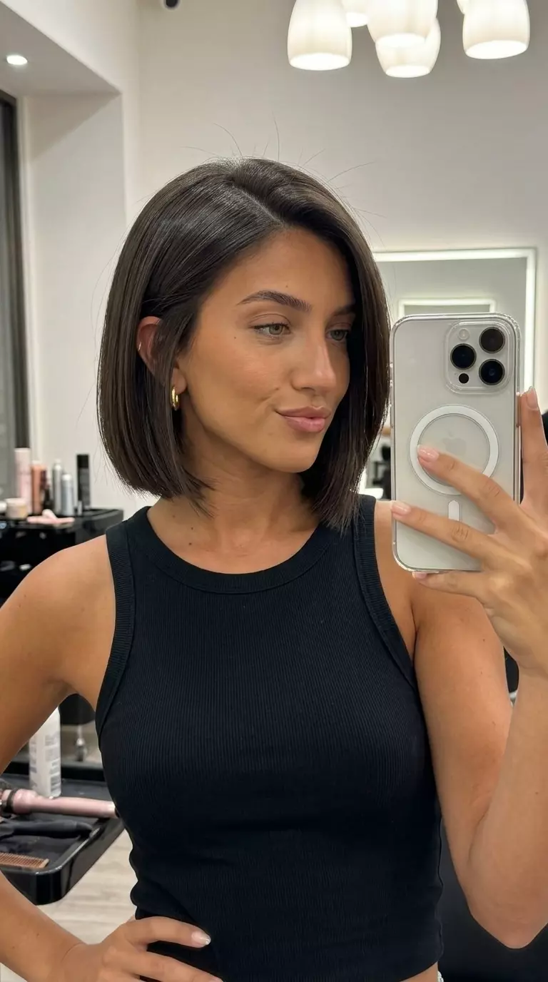 Liquid Metal Sculpted Bob 2026 short espresso bob haircut with cool undertones, razored ends, no fringe — edgy date night
