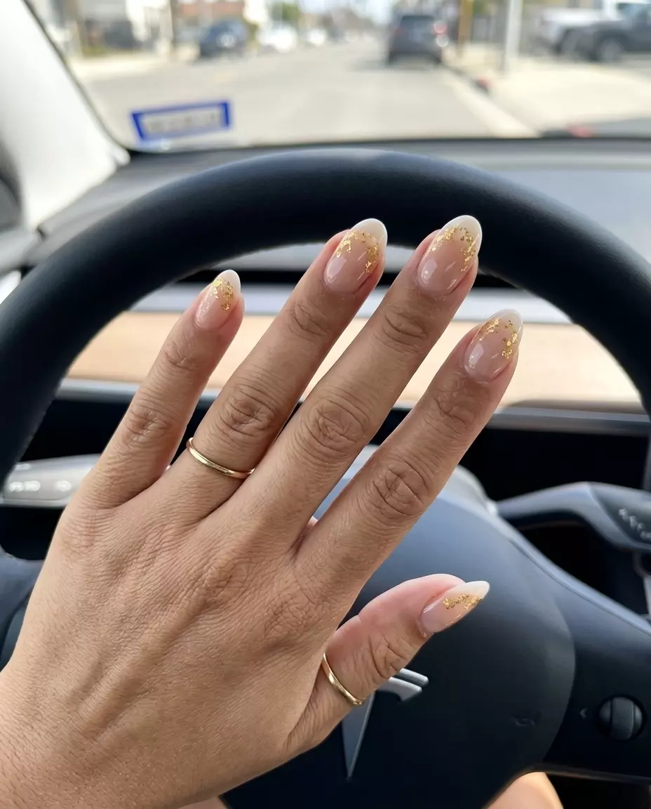 Gold Flake French Manicure Summer 2026 Glamorous gold flake nude French manicure for french manicure summer 2026. Perfect for parties.