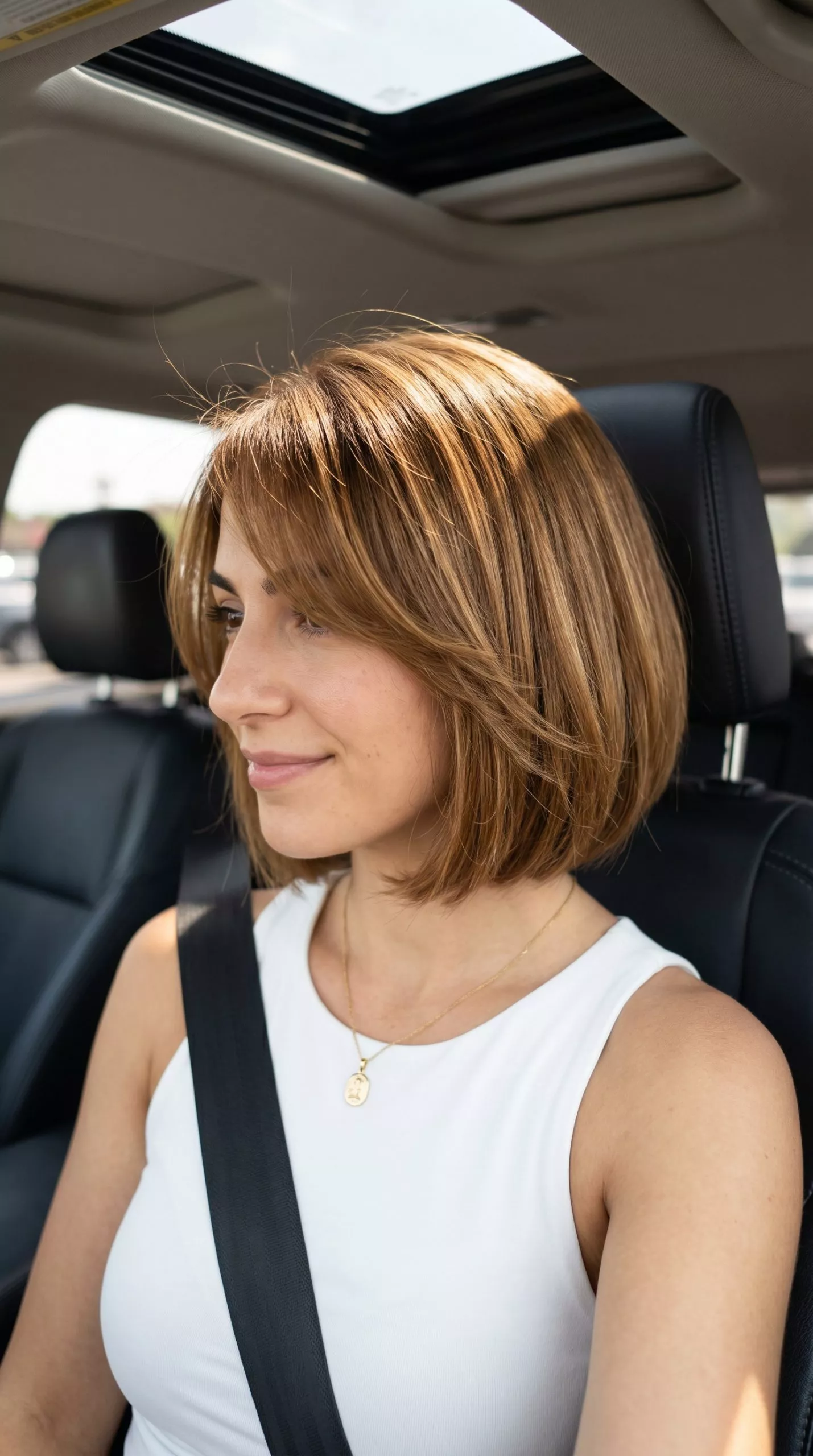 chin-length textured bob haircut with golden brown honey undertones and point-cut ends for a natural vibe
