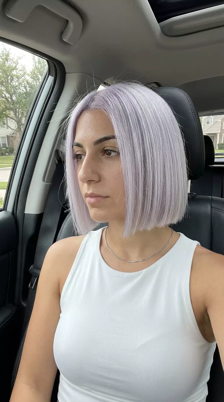 chin-length blunt bob haircut in icy platinum with violet undertones for summer 2026