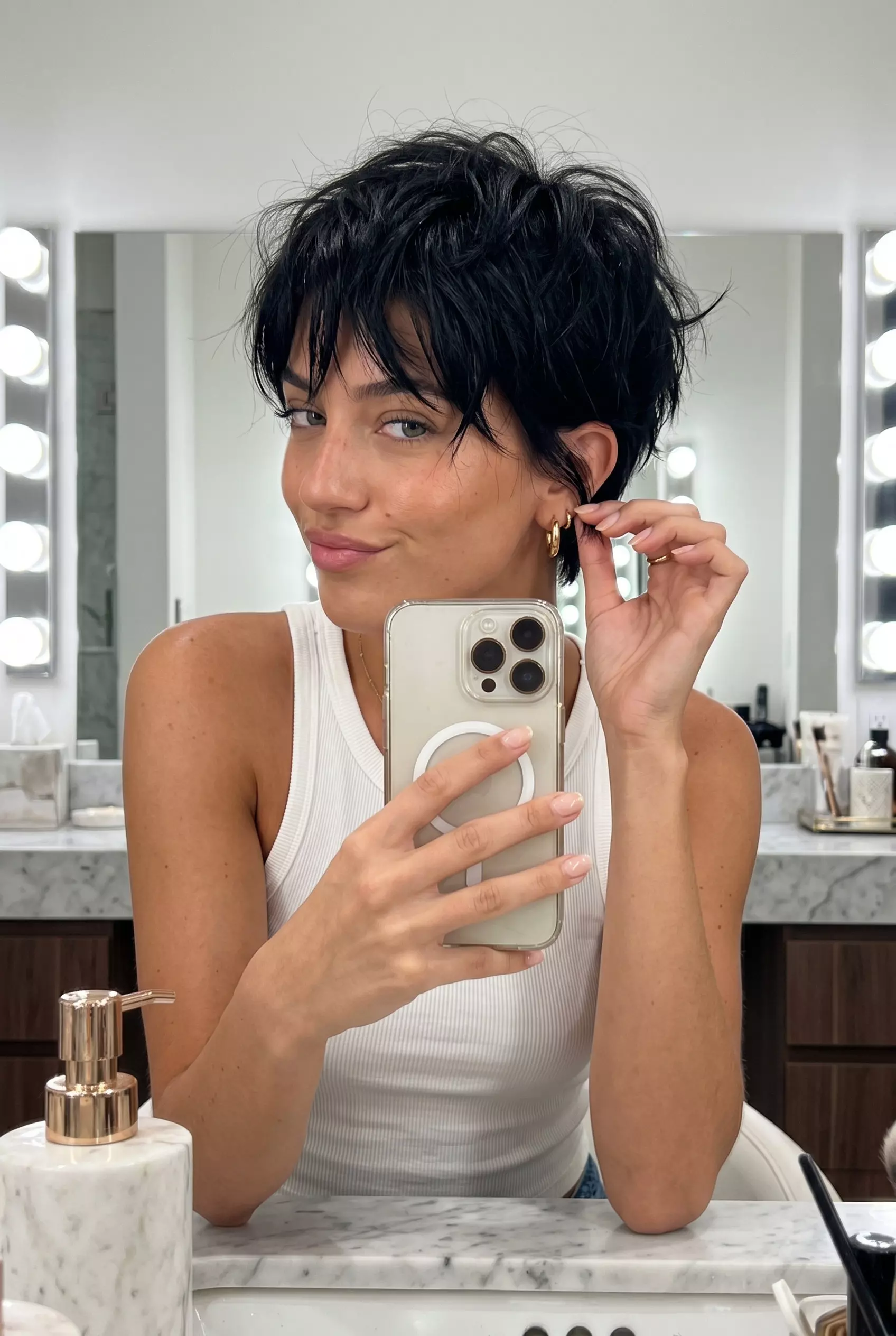 Jet Black Tousled Pixie 2026 short jet black pixie haircut with tousled texture and tapered sides for edgy look