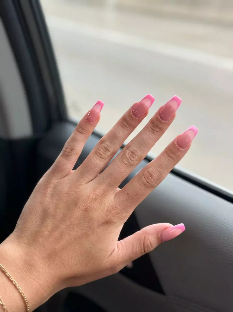 Juicy Pink Reverse French 2026 Juicy pink reverse French manicure, bright pink cuticle cap. June manicure ideas - summer trends 2026.
