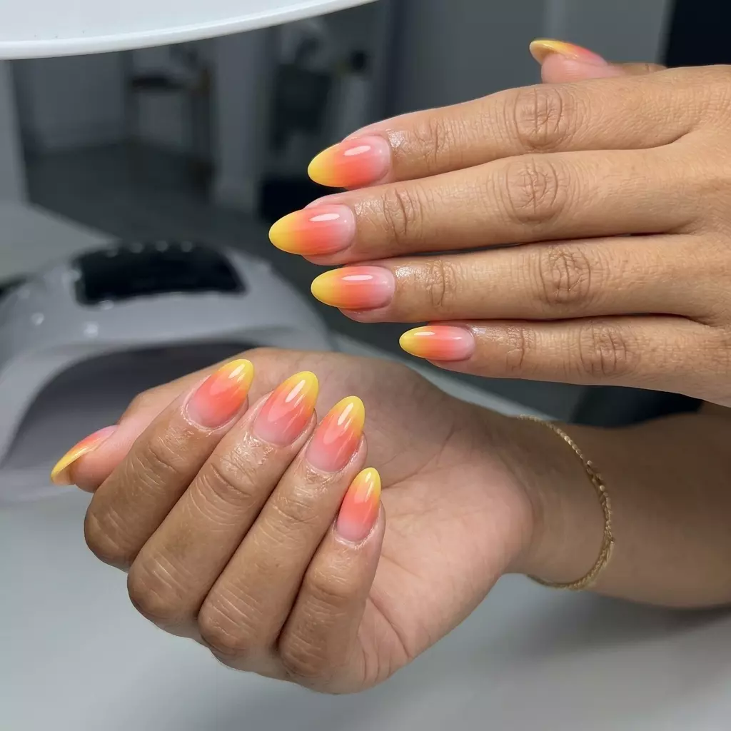 Sunset Ombre Almond Nails 2026 Sunset ombre almond nails, pink to orange to yellow gradient. June manicure ideas - summer trends 2026.