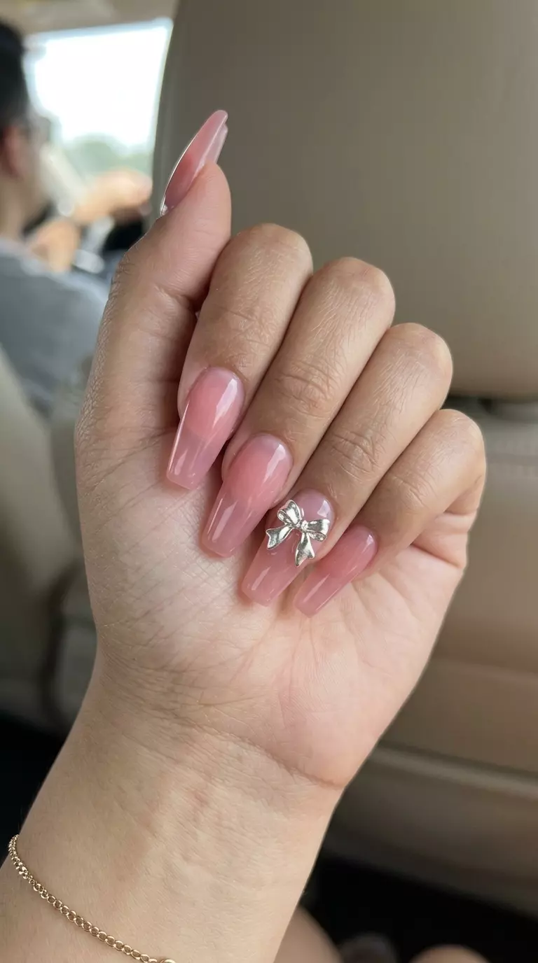 Kawaii Jelly Bow Nails 2026 | Y2K Party Style Kawaii Jelly Bow Coffin nails: Translucent pink jelly with 3D silver/gold bows. Perfect for Y2K party looks. June nails ideas - summer ideas 2026.