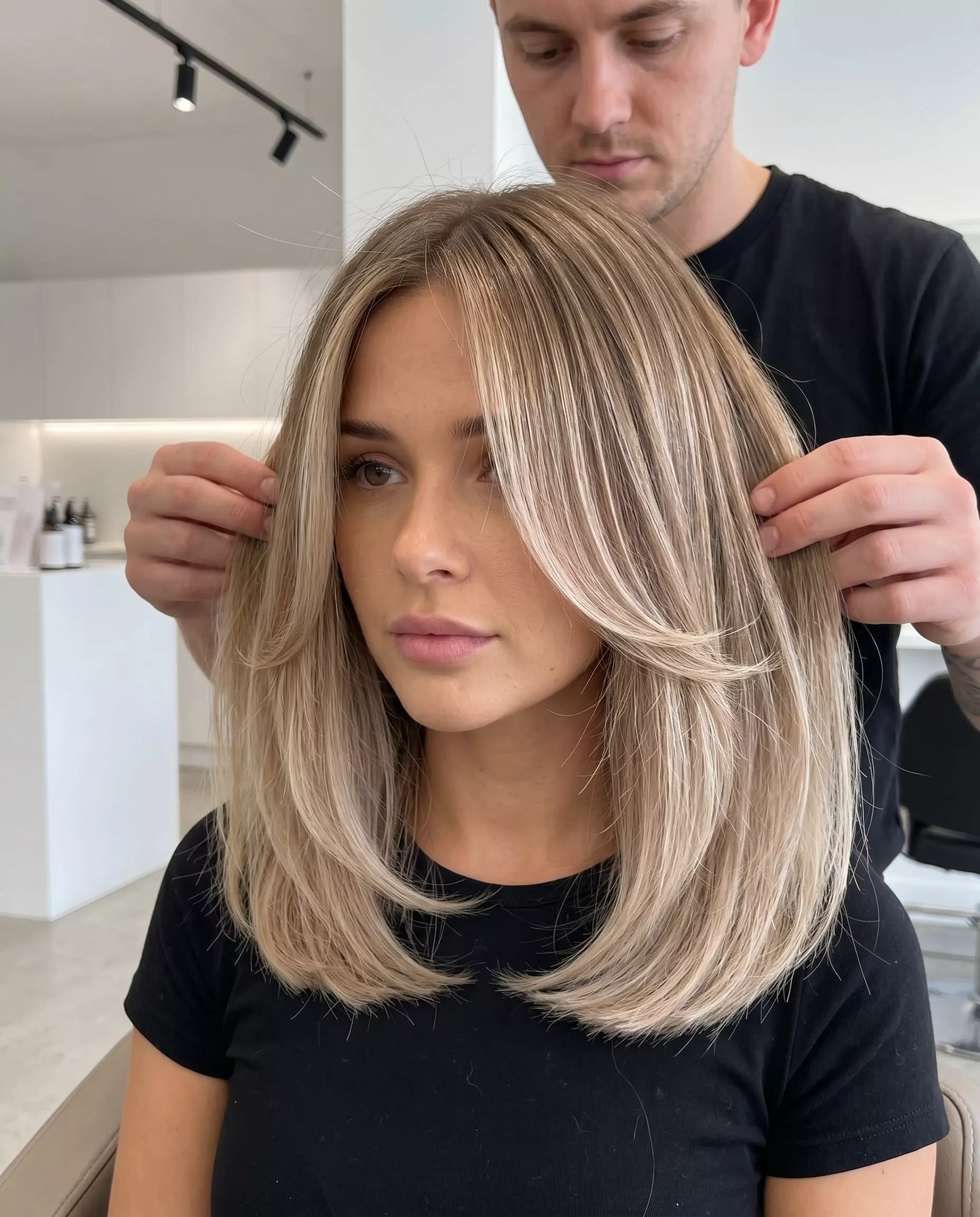 shoulder-length linen blonde ombre with babylights and inward-curving face-framing layers for summer