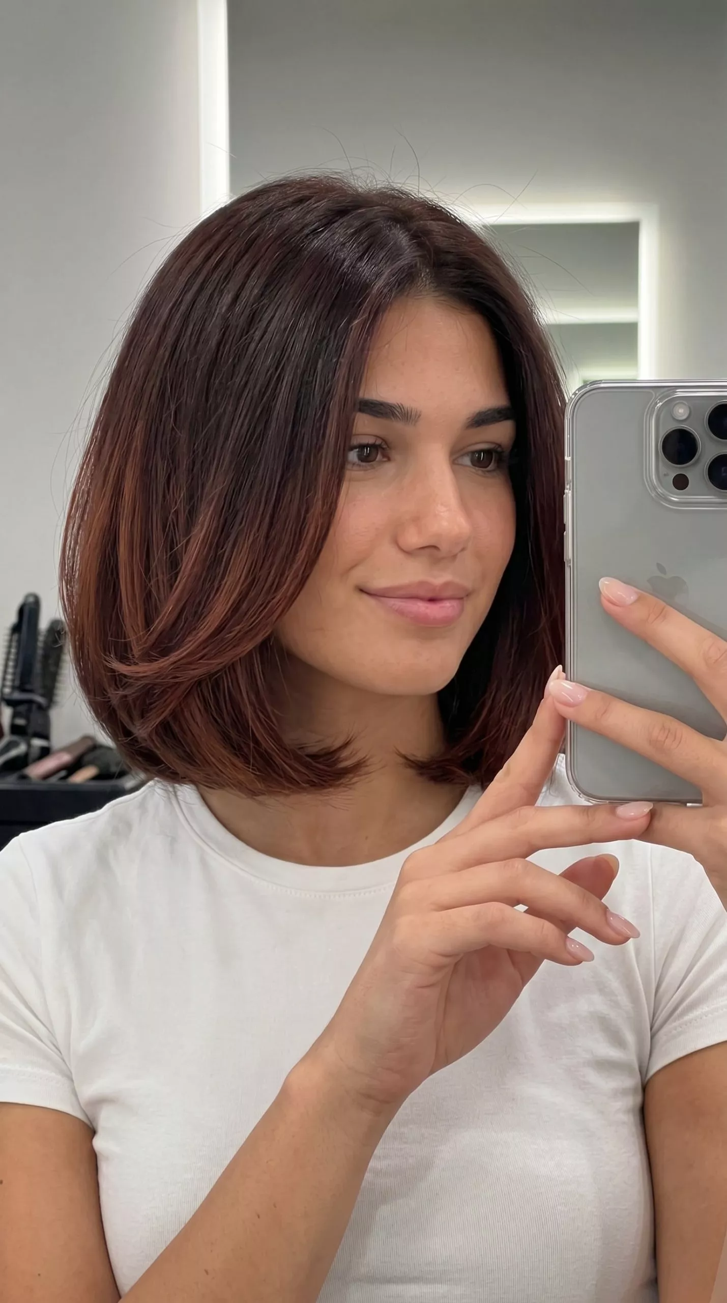 Mahogany Ombré Italian Bob: Elegant Summer Hair 2026 short Italian bob haircut in chocolate brown with mahogany ombré and auburn undertones, blunt perimeter and volume for summer
