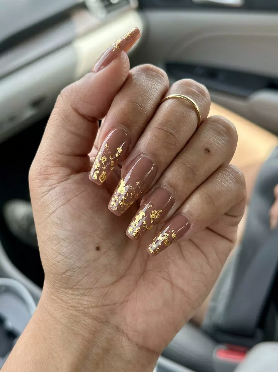 Gilded Nude Foil Flake Nails | Summer 2026 Glamorous Gilded nude manicure with luxury gold foil flakes for summer 2026 formal events and business meetings. Glamorous & chic.