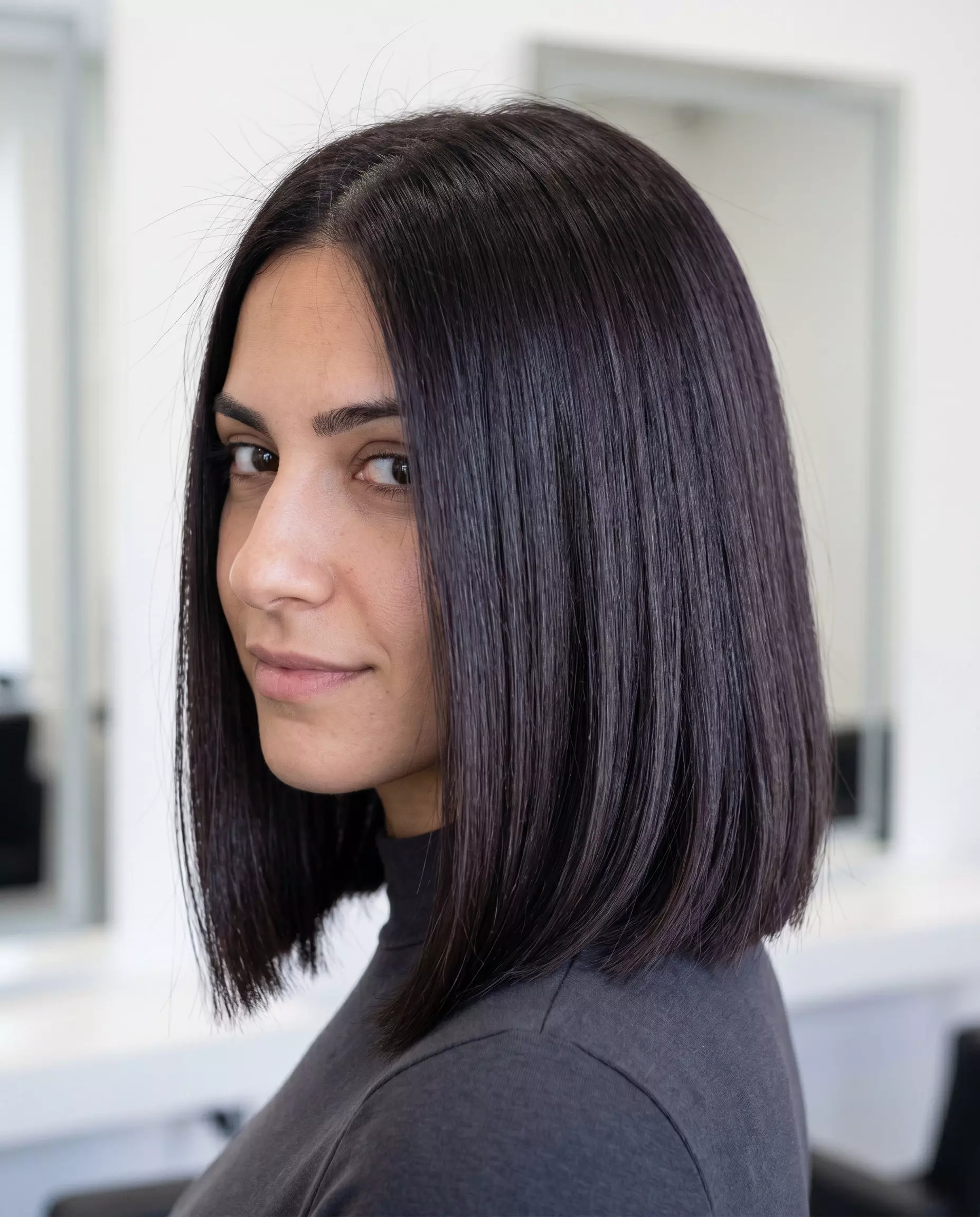 Midnight Espresso Gloss Lob 2026 collarbone-length blunt lob haircut with midnight espresso brown color, sleek finish, no bangs — professional
