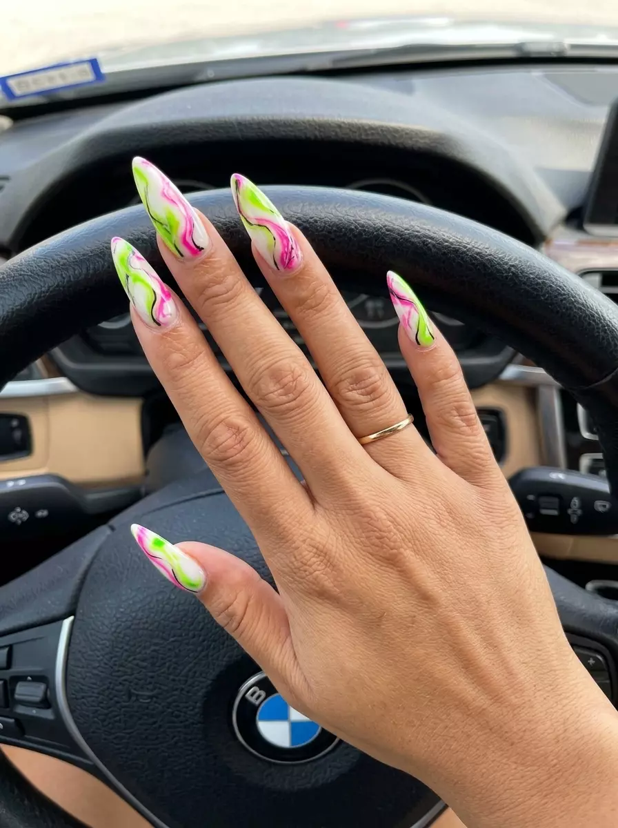 Bold electric lime & hot pink marble nails. Neon summer nails 2026 for parties.