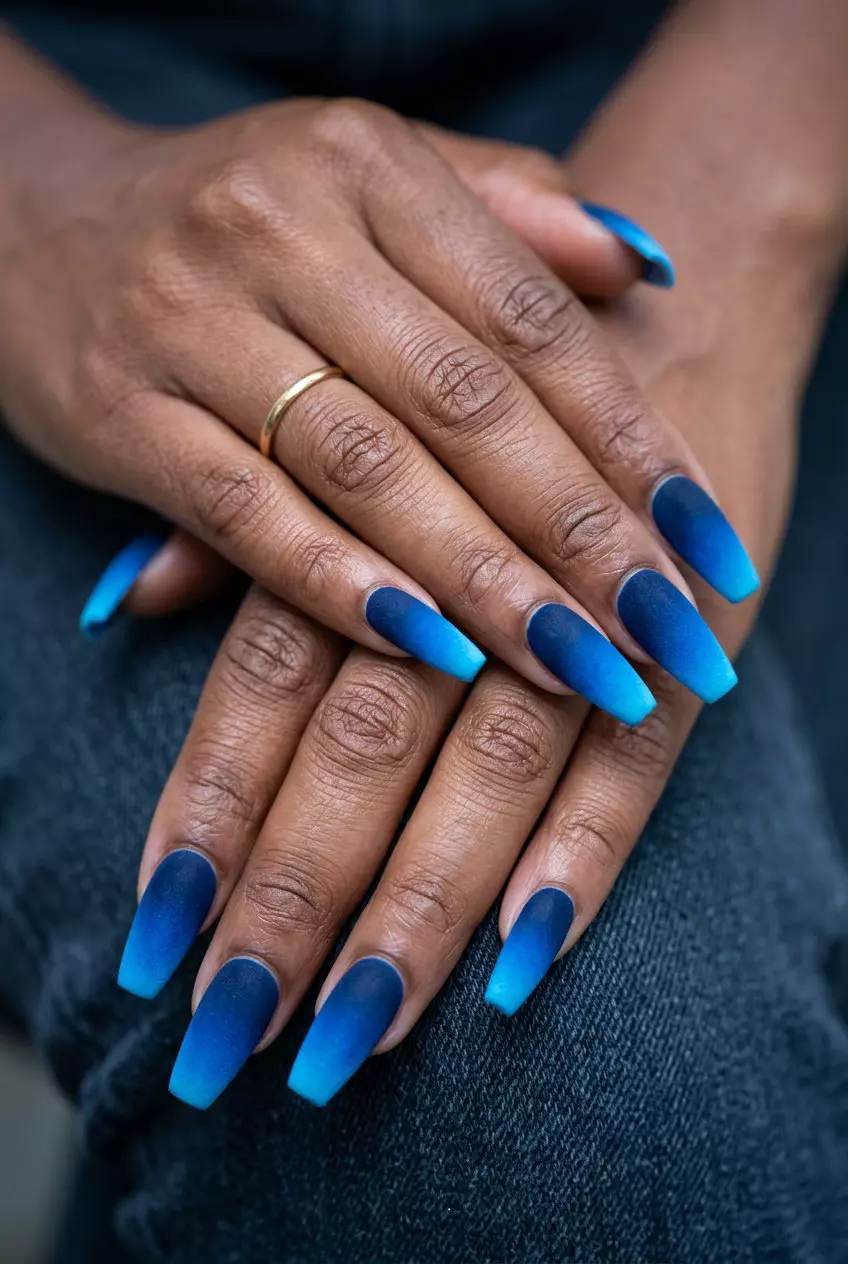 Sophisticated navy to neon blue gradient with velvet matte finish. Neon summer nails 2026.