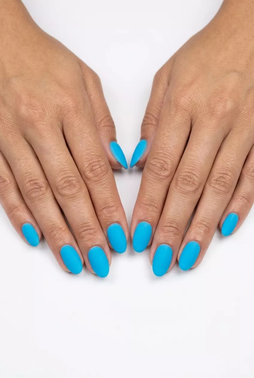 Bold opaque neon blue nails for vacation. Neon summer nails 2026.