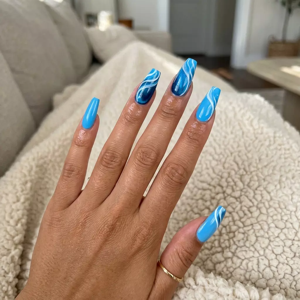 Ocean Wave Cat-Eye Swirls | Summer Acrylic Nails 2026 Ocean Wave Cat-Eye Swirls: Sultry sky blue and deep blue acrylic nails with iridescent shift for date night. Simple summer acrylic nail designs 2026.