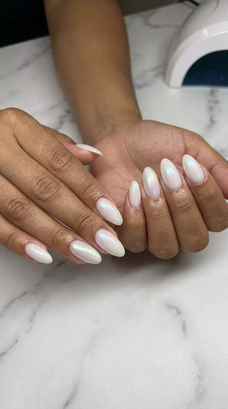 Subtle Shimmer Summer Dust Nails 2026 Sophisticated milky white acrylic nails with iridescent shimmer for simple summer acrylic nail designs 2026.