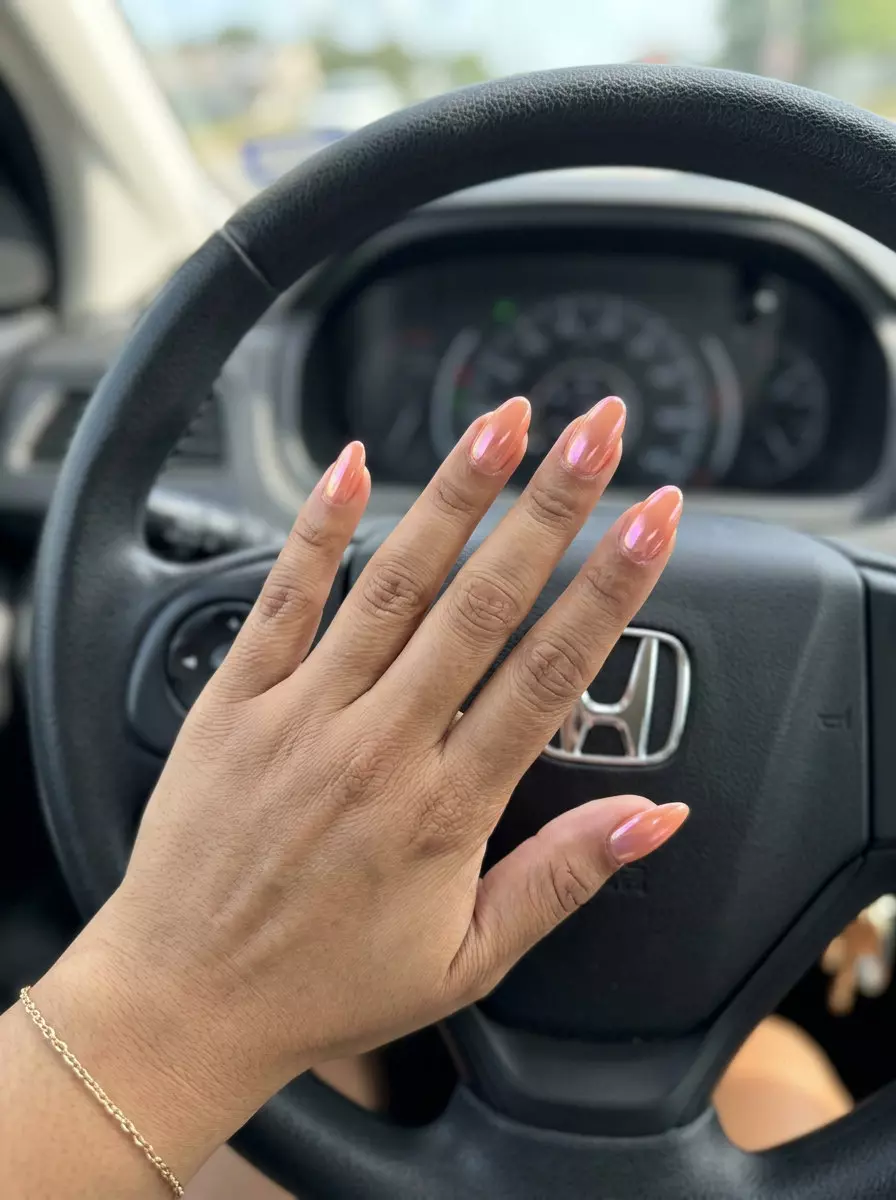Peach Chrome Almond Nails 2026: Vacation Radiance Peach chrome almond nails for solid summer nails 2026, perfect for vacations and glamorous evenings.