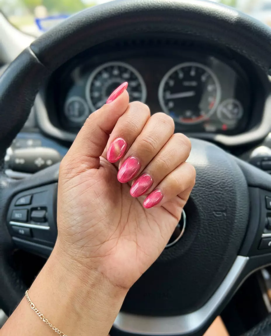Watermelon Pink Cat-Eye Nails 2026: Vacation Ready Watermelon pink cat-eye nails for solid summer nails 2026, ideal for vacations and festivals. Vibrant and playful.