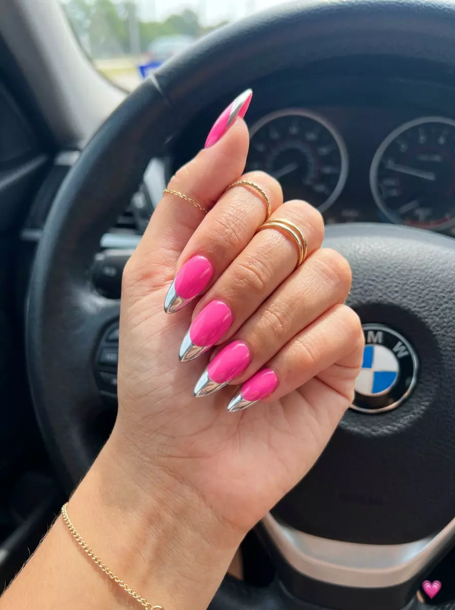 Hot pink stiletto summer nails 2026 with mirror silver chrome French tip for a bold party look.