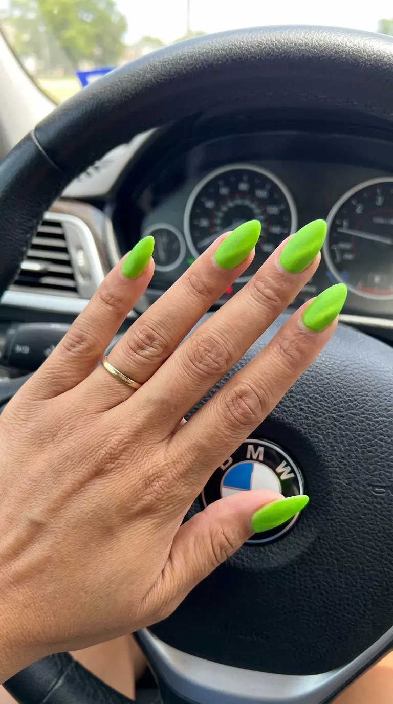 Electric lime green stiletto summer nails 2026 with a velvet matte finish for a bold look.