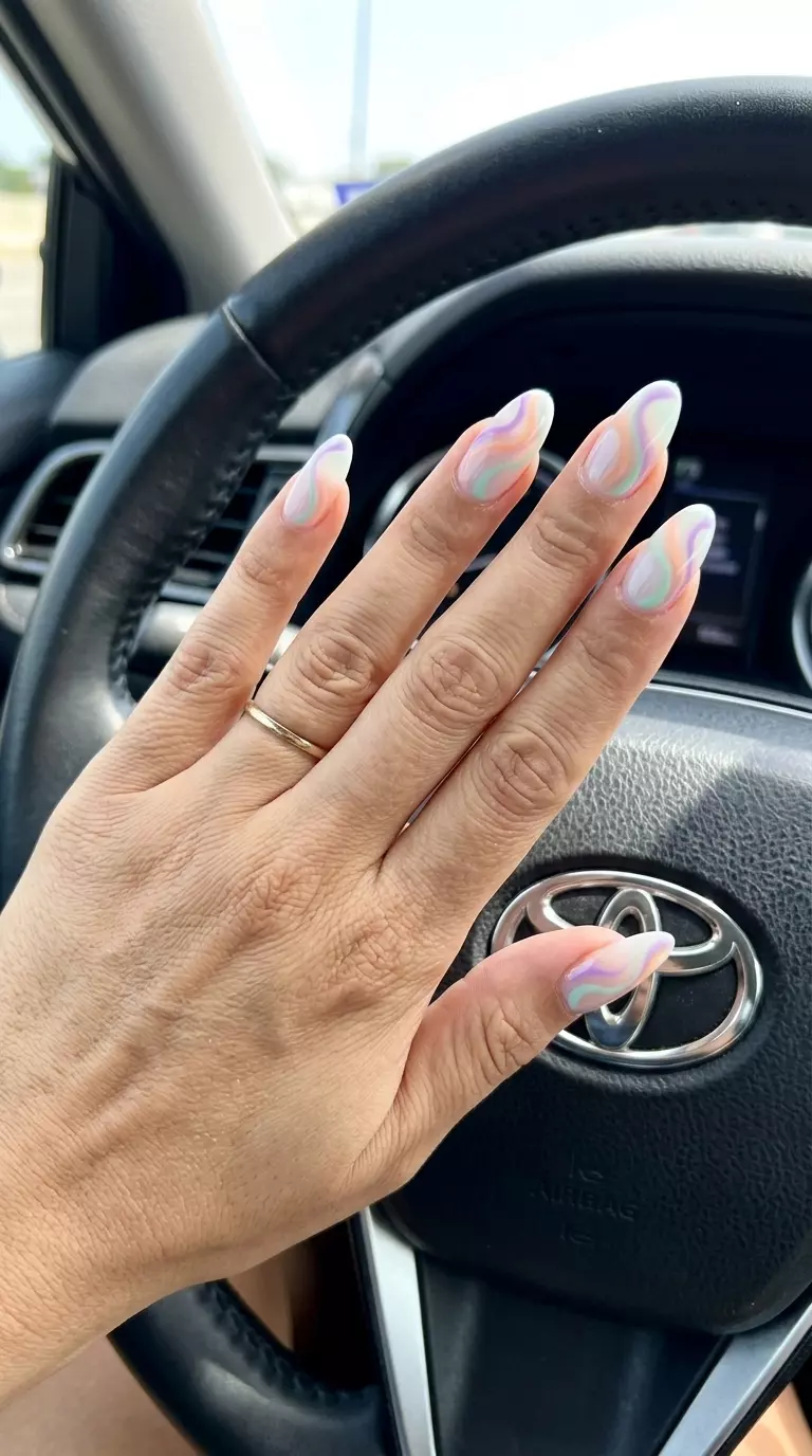Abstract Swirl Pastel Mix Oval Nails 2026: Festival Fun Abstract Swirl Pastel Mix Oval nails: whimsical, artistic design with lavender, peach, and mint green for summer parties 2026.