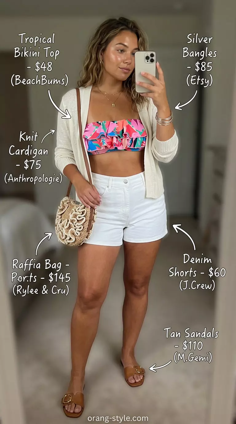 Tropical printed bandeau top with white denim shorts and a raffia bag for vacation vibes.