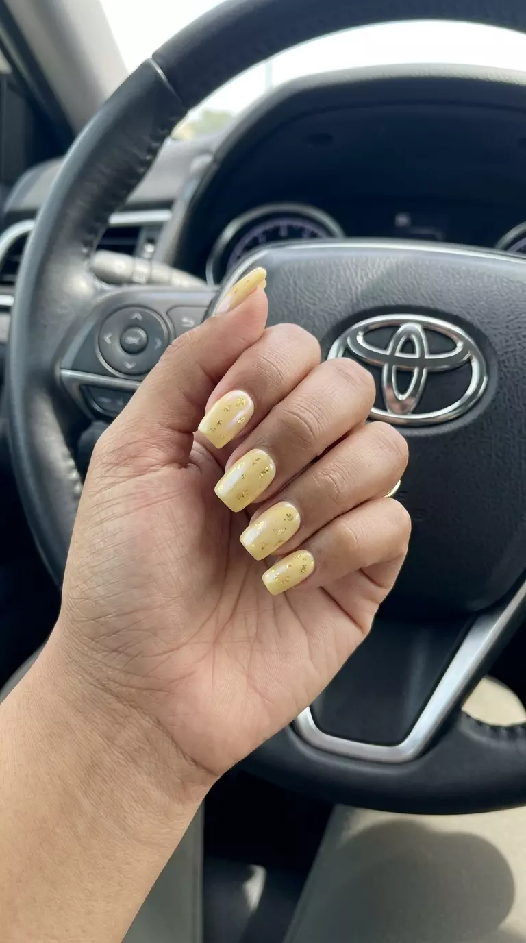 Butter Yellow Glazed Donut Nails 2026 | Summer Soiree Butter yellow glazed donut nails with gold foil for summer birthday nails 2026. Chic, glowy soiree style.
