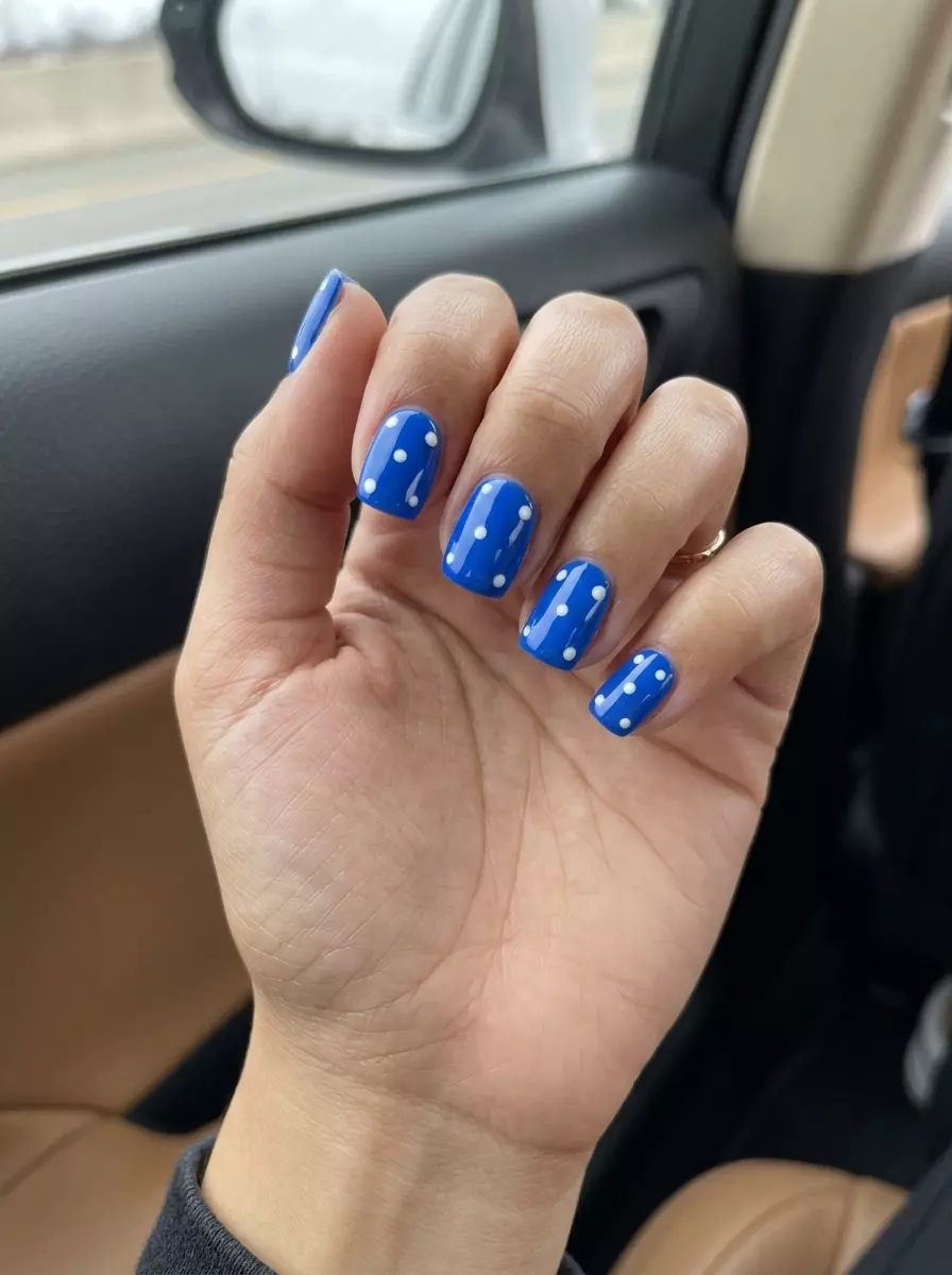 Electric Blue Dot Nails 2026: Playful Birthday Electric blue abstract dot nails for summer birthday nails 2026. Playful, artistic, bold medium coffin nails.