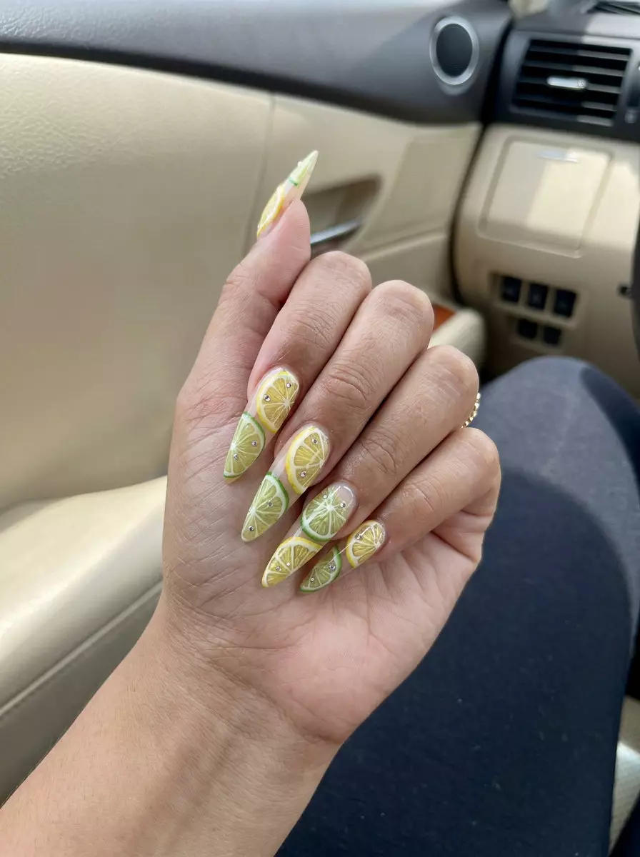 Citrus Slices Stiletto Nails 2026: Edgy Party Look Sharp citrus slices stiletto nails for summer citrus nail art 2026, bold and edgy party style.