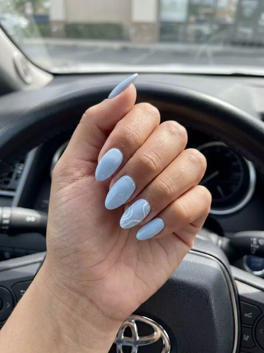 Summer Classy Nails 2026: Chic Blue Swirls Minimalist pale blue nails with delicate white swirls, perfect for summer classy nails 2026 daily wear.