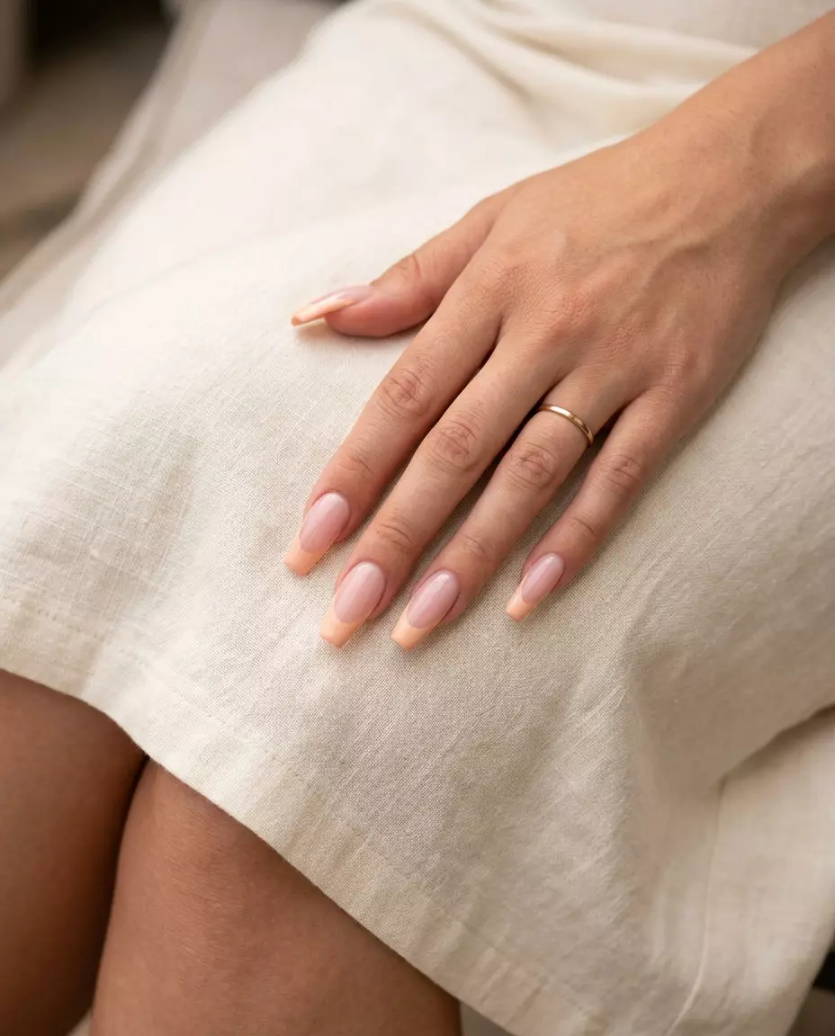 Peachy French Twist Coffin Nails 2026 Peachy French Twist Coffin nails: milky pink base with soft peach tips. Perfect for summer classy nails 2026 date nights.