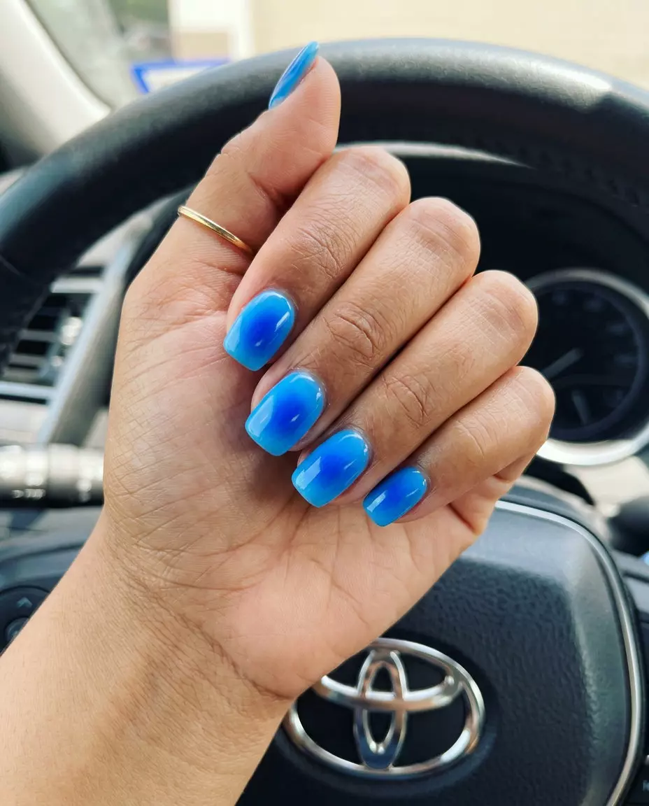 Summer Colorful Nails 2026: Electric Blue Aura Electric Blue Aura Squoval nails: Summer colorful nails designs 2026 for everyday, casual, festival. Futuristic & vibrant.