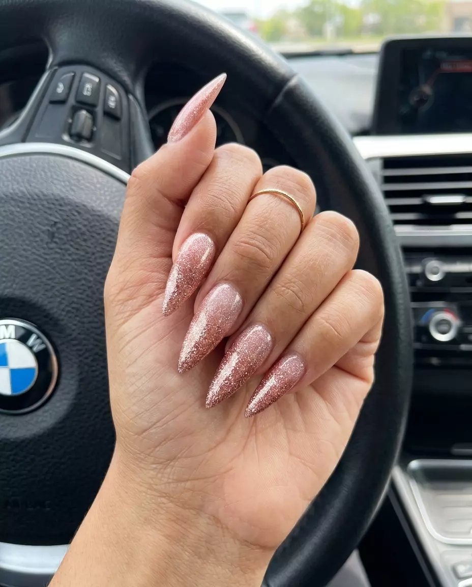 Glamorous stiletto nails with rose gold shimmer and dense glitter for summer glitter nails 2026.