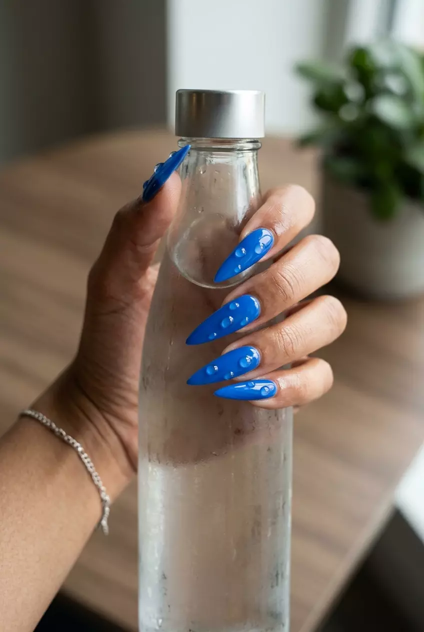 Crystal Dewdrop Stiletto Nails 2026 | Glamorous Party Crystal Dewdrop Stiletto nails for summer inspired nails 2026. Glamorous bold color with 3D embellishments.